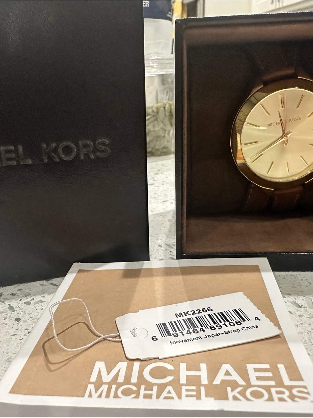 Women. MK leather strap wrap around watch.
